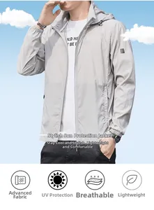Detail view of lightweight sun protection jacket fabric with sleeve patch against blue sky