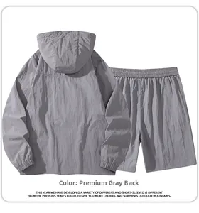 Back view of light grey hooded windbreaker and matching shorts set for outdoor sports