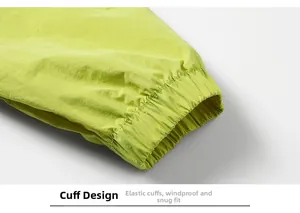 Close-up of elastic cuffs on a fluorescent green windbreaker for windproof wrist fit