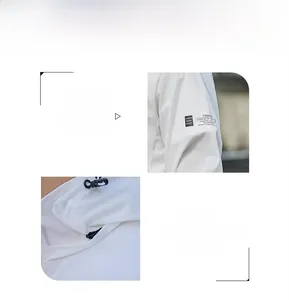 Detail view of white sun protection jacket with detachable hood and sleeve badge
