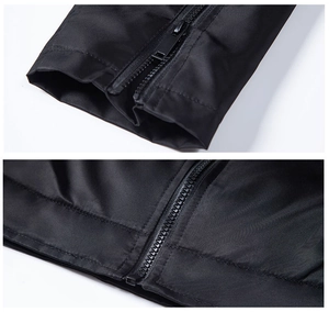 Detail view of smooth windproof fabric with zipper closure on black jacket sleeve