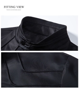 Detail of black stand collar jacket featuring snap button and premium stitching texture