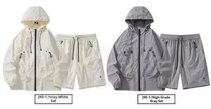Flat lay of men's hooded outdoor sun protection jacket and shorts sets in ivory and grey