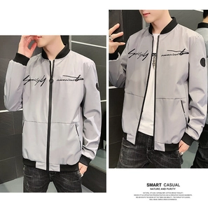 Detail view of light grey bomber jacket with black ribbed cuffs and script embroidery