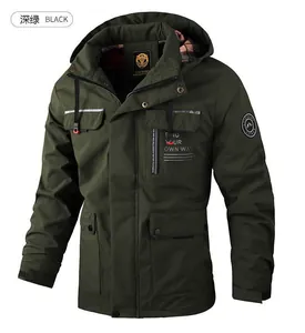 Detail of dark green men's hooded outdoor parka showing zipper and velcro cuffs