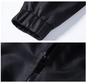 Close-up of elastic cuffs and durable black zipper on a men's stand-collar biker jacket