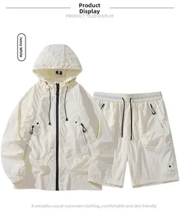 Flat lay of ivory white lightweight sun protection jacket and elastic shorts set