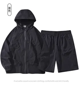 Detail of black hooded sun protection jacket and drawstring shorts set in thin fabric
