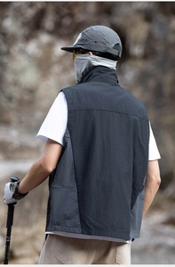 Detail of outdoor tactical vest showing durable ripstop nylon texture and back stitching