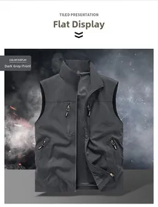 Detail of multi-pocket utility vest showing deep grey fabric and breathable mesh lining