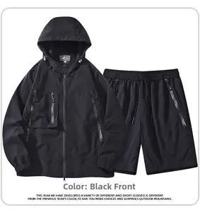 Detail view of the black hooded windbreaker jacket and matching shorts two-piece outdoor set