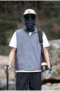 Close-up of lightweight hiking vest with zip pockets and breathable mesh panels
