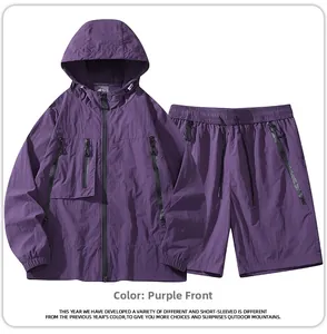 Flat lay of purple hooded windbreaker set with multi-pocket jacket and matching shorts