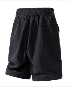 Detail of high-elastic pleated waistband on black water-repellent cargo shorts