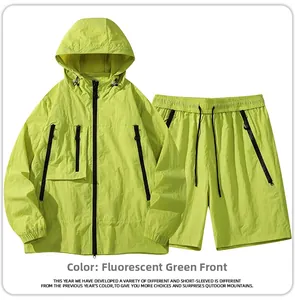 Detail view of neon green outdoor set featuring hooded jacket and utility shorts fabric