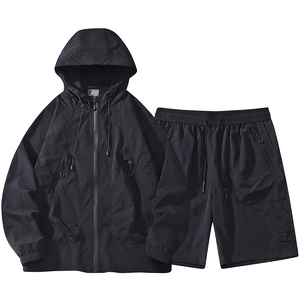 Men's black hooded outdoor windbreaker set with matching shorts in lightweight fabric