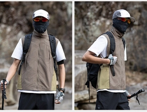 Detail showing outdoor vest with standing collar and pockets for hiking and camping