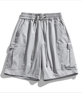 Detailed shot of dark grey cargo shorts featuring adjustable elastic drawstring waistband