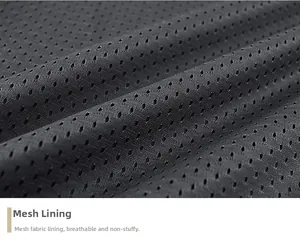 Macro shot of breathable dark grey honeycomb mesh lining for men's fishing vest