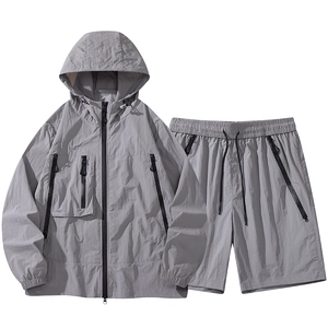 Light grey hooded windbreaker and shorts set with zipper pockets for outdoor sports