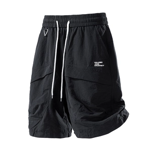 Water-repellent cargo shorts in black with elastic drawstring waist and side flap pockets