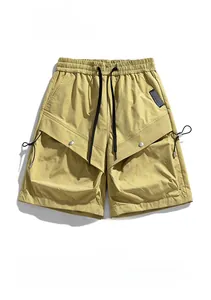 Detail of cargo shorts featuring water-repellent fabric and large utility flap pockets