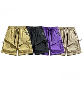 Detail of four water-repellent cargo shorts in khaki black purple and beige