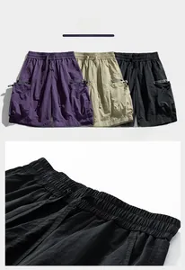 Detailed view of elastic waist with drawstring and large cargo pockets on summer shorts