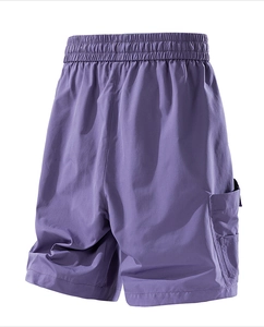 Close-up of lavender men's cargo shorts showing elastic waistband and utility pocket detail