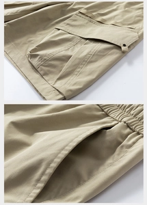 Detailed views of khaki cargo shorts with button-flap pockets and elastic drawstring waist