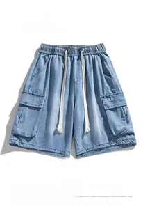 Detail of cargo pockets and washed texture on men's relaxed fit denim shorts
