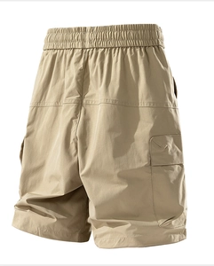 Detail of cargo shorts back view featuring elastic waistband and functional flap pockets