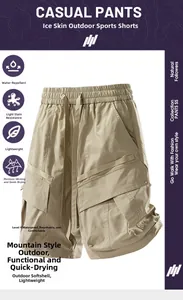 Detail of khaki functional cargo shorts featuring waterproof fabric and tactical pockets