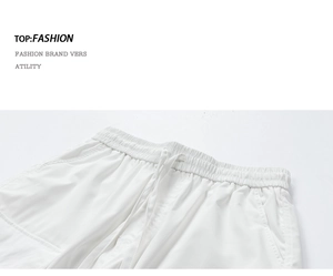 Detail of white water-repellent cargo shorts featuring an elastic drawstring waistband