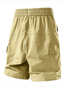 Detail view of khaki cargo shorts showing the elastic waistband and bellows pocket design
