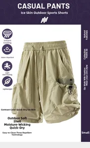 Detail of outdoor utility shorts featuring olive green cargo pockets and drawstring waist