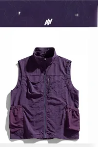 Detail view of purple outdoor vest featuring waterproof fabric and secure zipper pockets