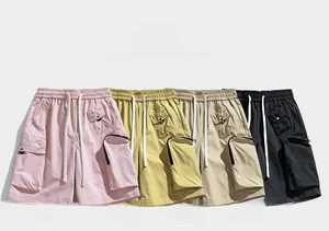 Detail showing various colors of water-resistant cargo shorts with drawstring waist