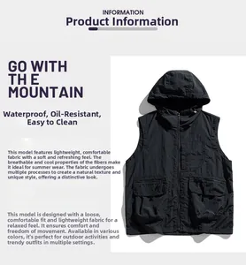 Détail du gilet outdoor noir montrant le tissu imperméable et les poches fonctionnelles