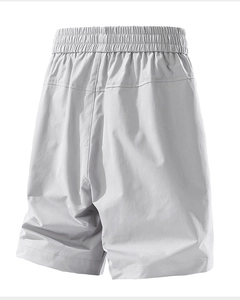 Detail view of men's summer shorts showing elastic waistband and quick-dry fabric texture