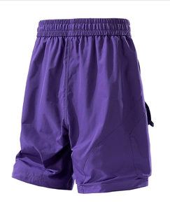 Detail of dark purple cargo shorts with elastic waistband and large side flap pockets