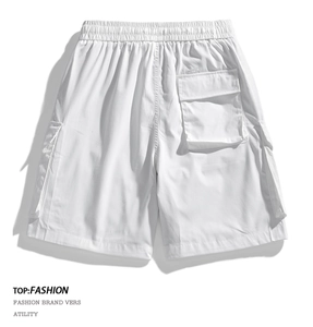 Detail view of white utility cargo shorts with elastic waist and large rear flap pocket
