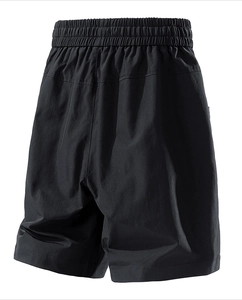 Detail of elastic drawstring waistband and stitching on black casual summer shorts