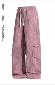Close-up of pink tie-dye cargo pants featuring elastic waist and white drawstrings