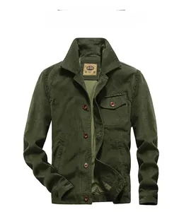 Close-up of dark green corduroy jacket texture featuring vintage brown buttons and pocket