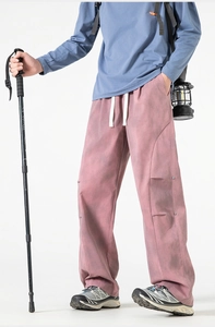 Detail of outdoor utility pants featuring elastic drawstring waist and reinforced seams