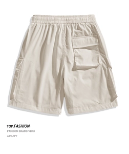Detail of off-white water-repellent cargo shorts featuring elastic waist and utility pocket
