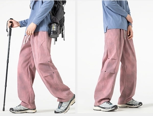 Detail of pink tie-dye straight-leg trousers with side button design and white drawstring