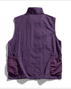 Detailed back view of dark purple outdoor vest featuring large elastic cargo pockets