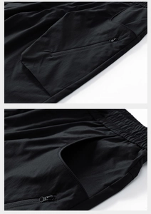 Detailed macro view of quick-dry fabric, elastic drawstring waist and hidden zipper pocket